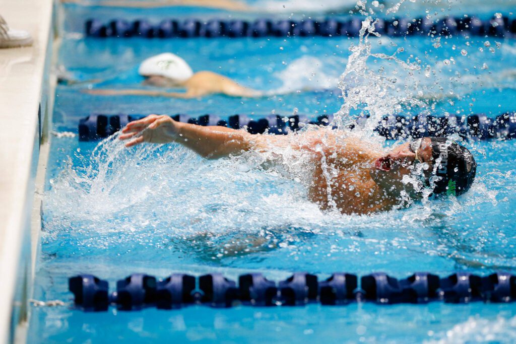 Jackson senior Ethan Chen-Parks makes the final turn in the 100 yard breaststroke consolation race during the WIAA 4A Boys Swim and Dive Championships on Saturday, Feb. 17, 2024, at the Weyerhaeuser King County Aquatic Center in Federal Way, Washington. (Ryan Berry / The Herald)

