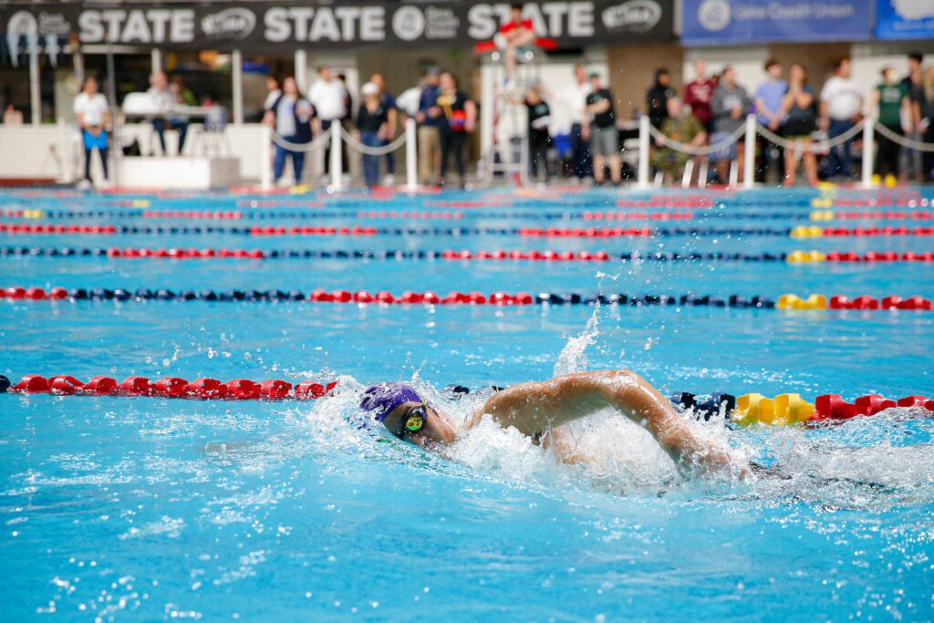 Kamiak’s Bryan Zi Wong heads to the finish line in the 500 yard freestyle consolation during the WIAA 4A Boys Swim and Dive Championships on Saturday, Feb. 17, 2024, at the Weyerhaeuser King County Aquatic Center in Federal Way, Washington. (Ryan Berry / The Herald)
