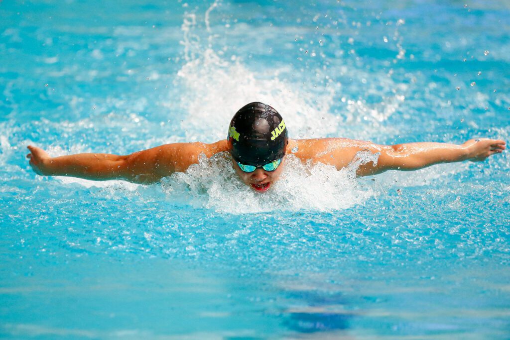Jackson junior Byron Domingo swims the butterfly in the 200 yard individual medley during the WIAA 4A Boys Swim and Dive Championships on Saturday, Feb. 17, 2024, at the Weyerhaeuser King County Aquatic Center in Federal Way, Washington. (Ryan Berry / The Herald)

