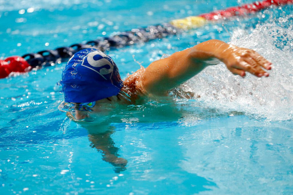A Shorewood swimmer takes his turn in the 4×50 freestyle relay final during the WIAA 3A Boys Swim and Dive Championships on Saturday, Feb. 17, 2024, at the Weyerhaeuser King County Aquatic Center in Federal Way, Washington. (Ryan Berry / The Herald)
