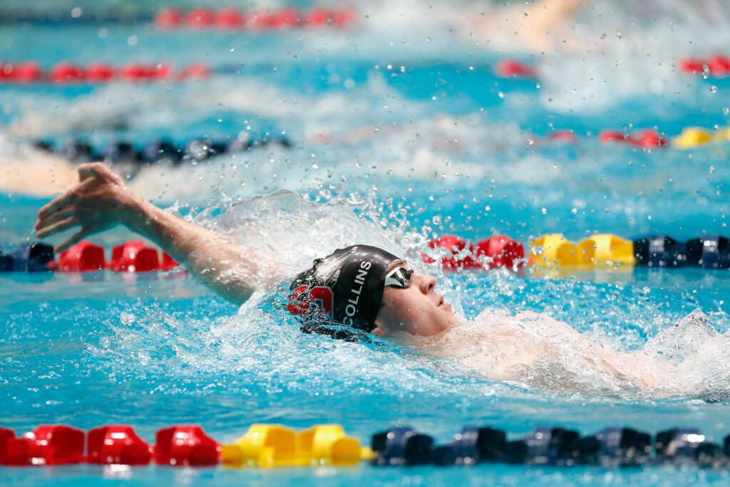 Snohomish junior Owen Collins swims the backstroke in the 200 yard individual medley final during the WIAA 3A Boys Swim and Dive Championships on Saturday, Feb. 17, 2024, at the Weyerhaeuser King County Aquatic Center in Federal Way, Washington. (Ryan Berry / The Herald)
