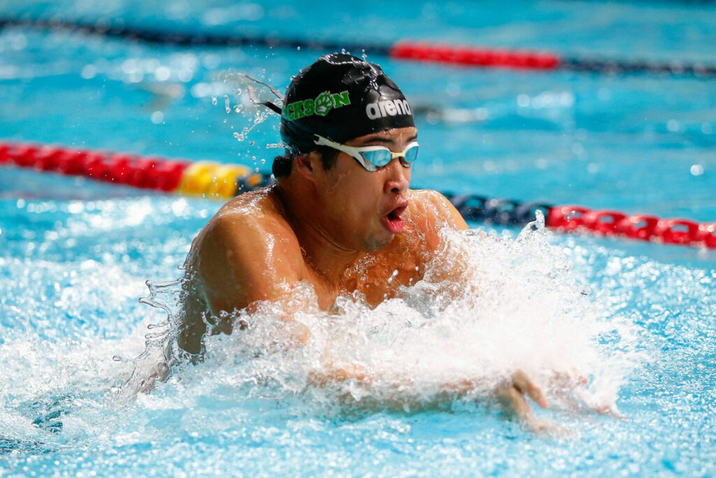 Jackson’s Ethan Chen-Parks swims the breaststroke in the 200 yard medley relay during the WIAA 4A Boys Swim and Dive Championships on Saturday, Feb. 17, 2024, at the Weyerhaeuser King County Aquatic Center in Federal Way, Washington. (Ryan Berry / The Herald)
