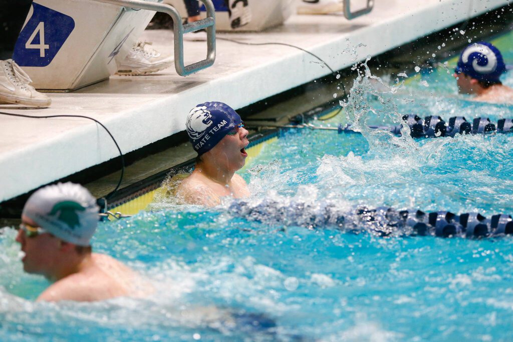 Glacier Peak senior Kaiu Taylor finishes the 50 yard freestyle consolation during the WIAA 4A Boys Swim and Dive Championships on Saturday, Feb. 17, 2024, at the Weyerhaeuser King County Aquatic Center in Federal Way, Washington. (Ryan Berry / The Herald)

