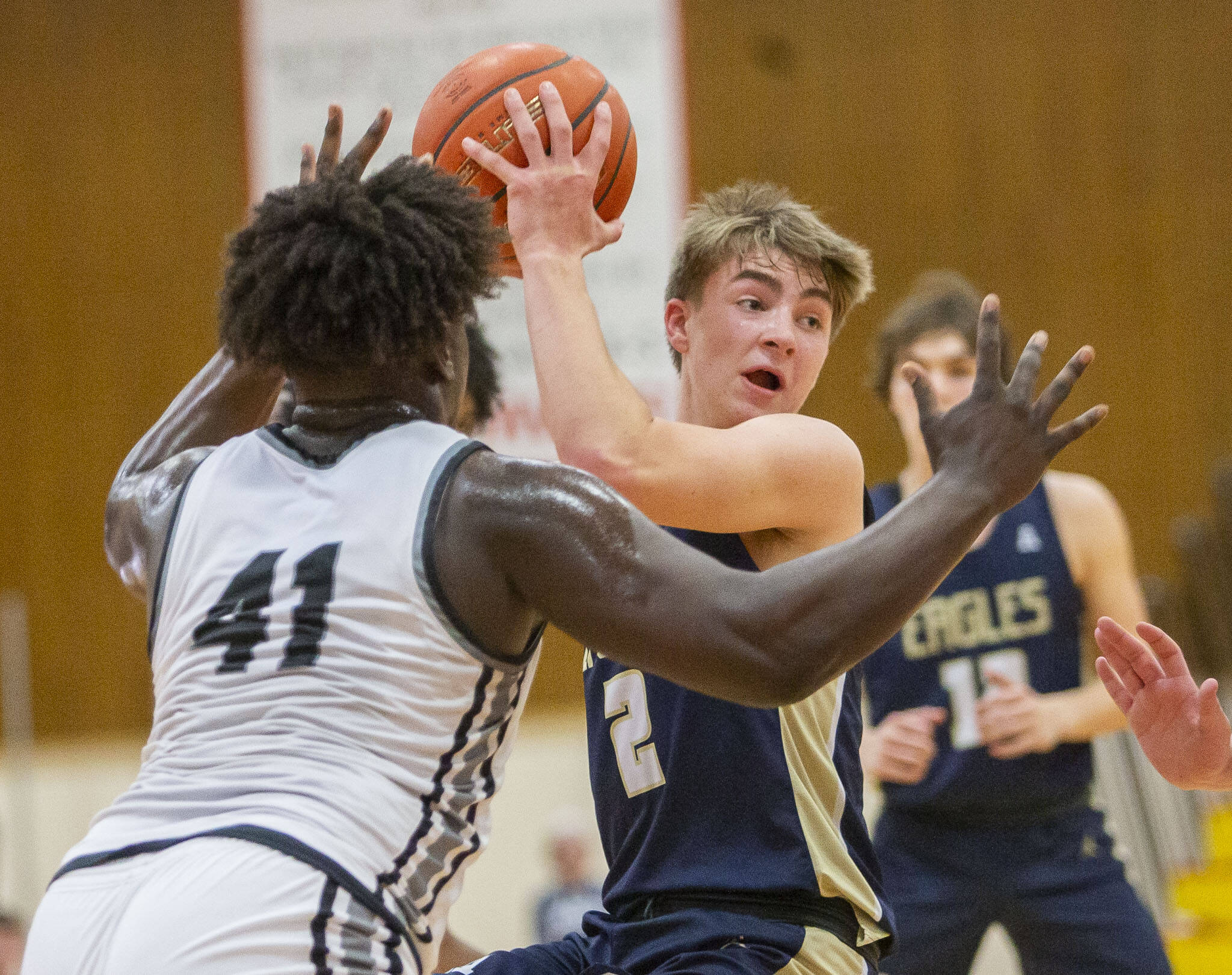 Arlington’s Leyton Martin looks for an open teammate to pass to during the 3A boys district championship game against Mountlake Terrace on Saturday, Feb. 17, 2024 in Marysville, Washington. (Olivia Vanni / The Herald)