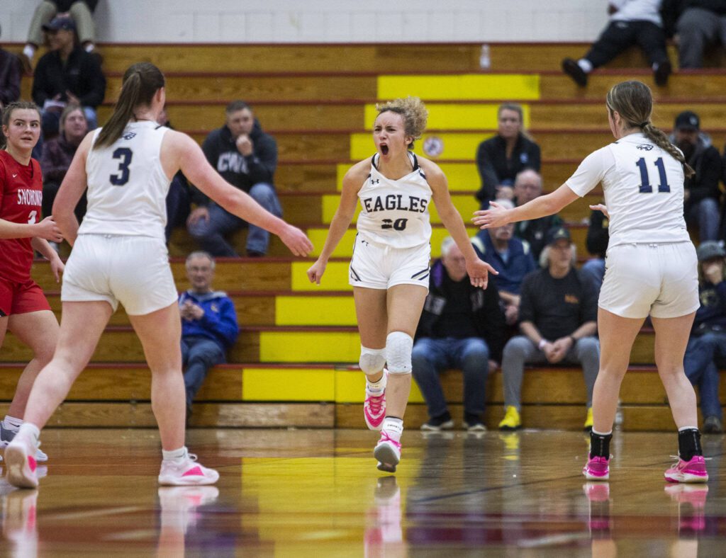 Arlington’s Samara Morrow reacts to drawing a foul call during the 3A girls district championship game against Snohomish on Saturday, Feb. 17, 2024 in Marysville, Washington. (Olivia Vanni / The Herald)
