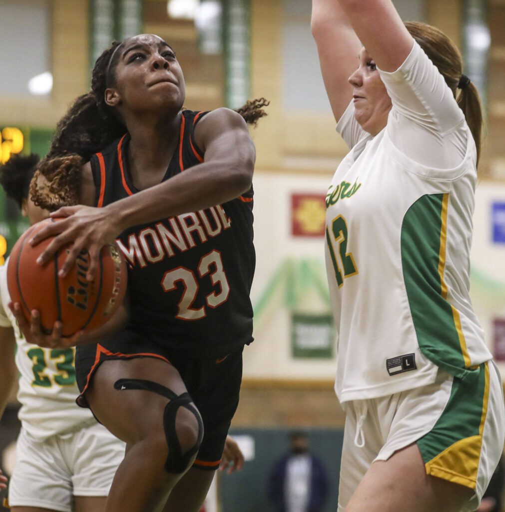 Monroe’s Halle Keller (23) goes up for a layup during a Class 3A state regionals game against Roosevelt at Roosevelt High School on Tuesday in Seattle. (Annie Barker / The Herald)
