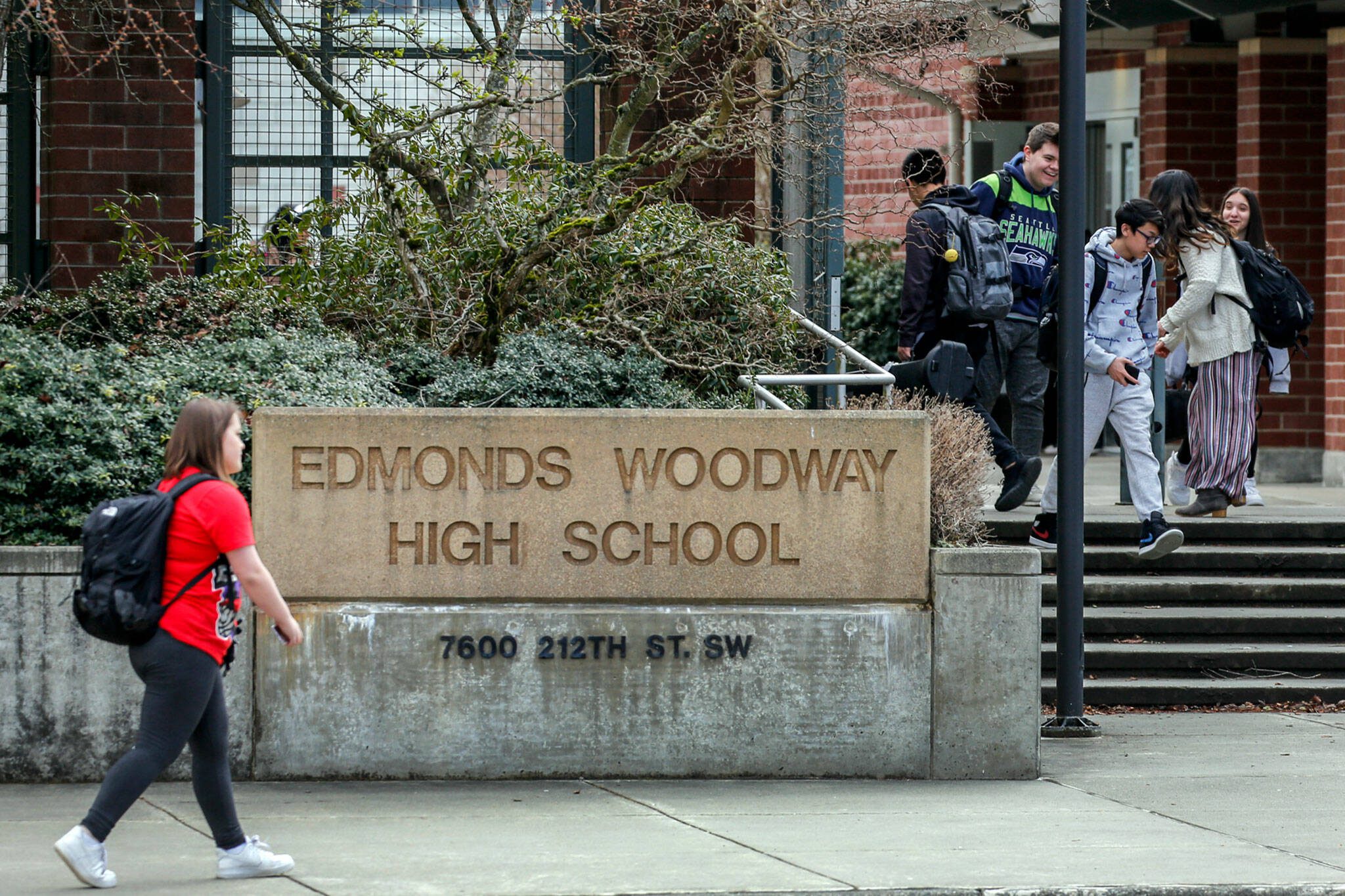 Students make their way after school at Edmonds-Woodway High School on March 12, 2020. (Kevin Clark / The Herald)