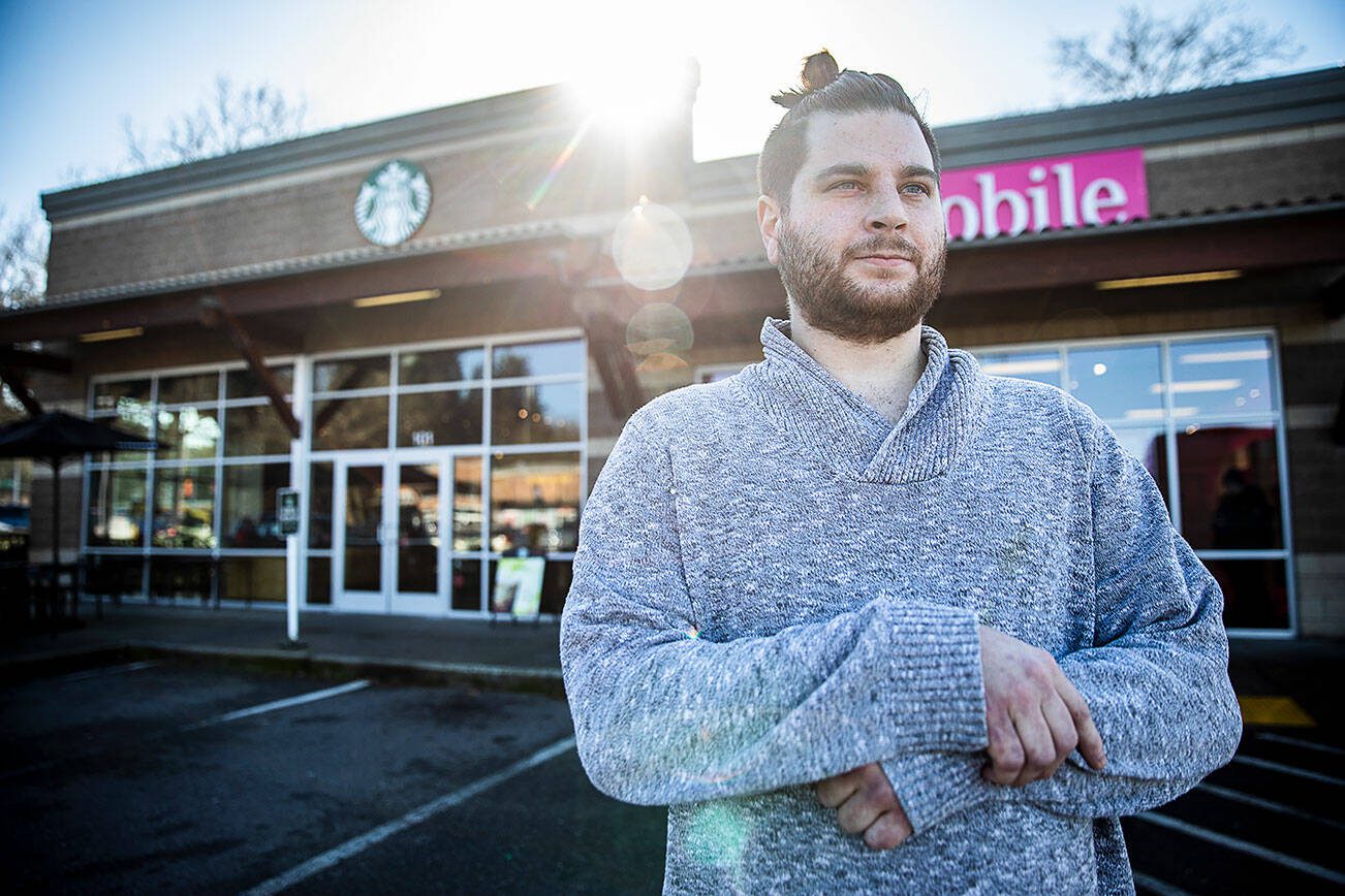 Starbucks employee Zach Gabelein outside of the Mill Creek location where he works on Friday, Feb. 23, 2024 in Mill Creek, Washington. (Olivia Vanni / The Herald)