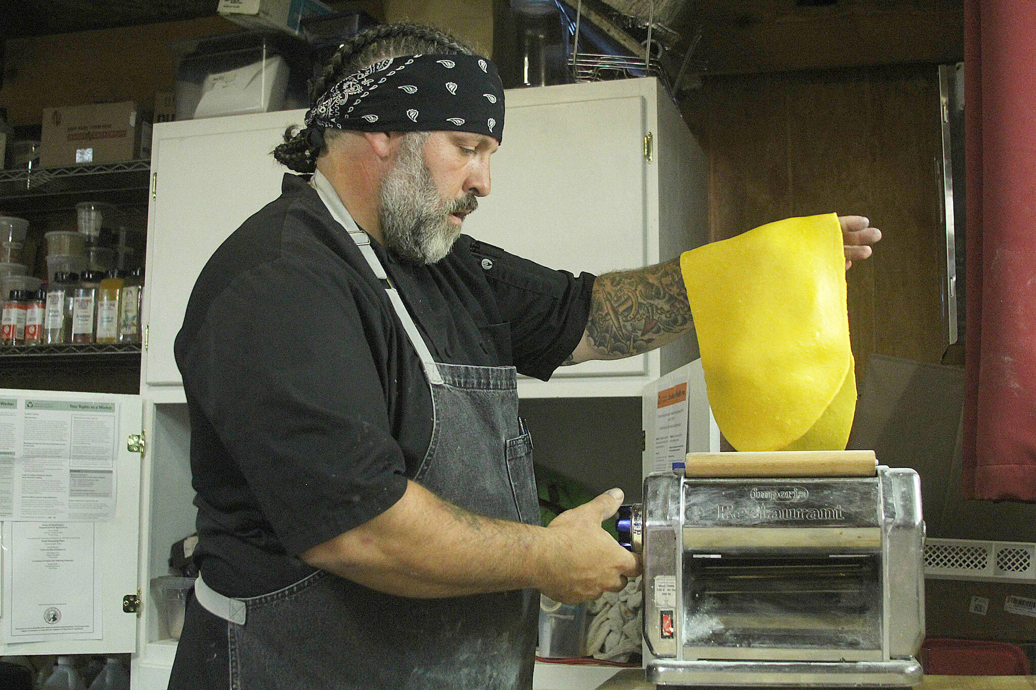 Thomas Litrenta, co-owner of Chef in the Black Bandana, makes pasta from scratch on June 30, 2023, in Oak Harbor. Litrenta and co-owner Crystal Madrigal are among dozens of Whidbey Island restaurateurs who complained to Island County about its food inspector’s alleged behavior. (Karina Andrew / Whidbey News-Times file)