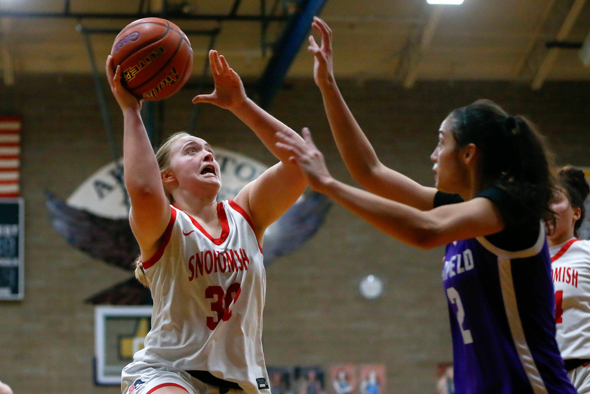 Snohomish senior Catherine Greene puts up a layup against Garfield during a playoff matchup at Arlington High School on Friday, Feb. 23, 2024, in Arlington, Washington. (Ryan Berry / The Herald)