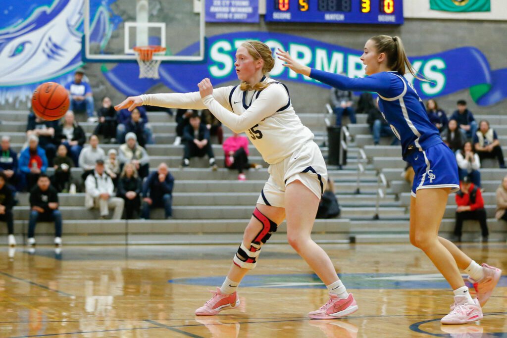Everett sophomore forward Emily Barton passes off the ball at the top of the key against Seattle Prep during a playoff matchup at Shorewood High School on Saturday, Feb. 24, 2024, in Shoreline, Washington. (Ryan Berry / The Herald)
