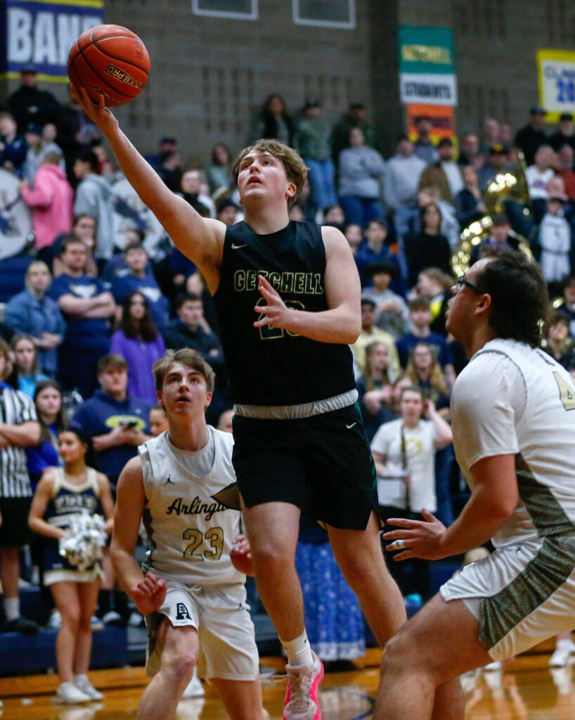 Marysville Getchell’s Zach Rice goes for a layup against Arlington during a playoff matchup at Arlington High School on Saturday, Feb. 24, 2024, in Arlington, Washington. (Ryan Berry / The Herald)
