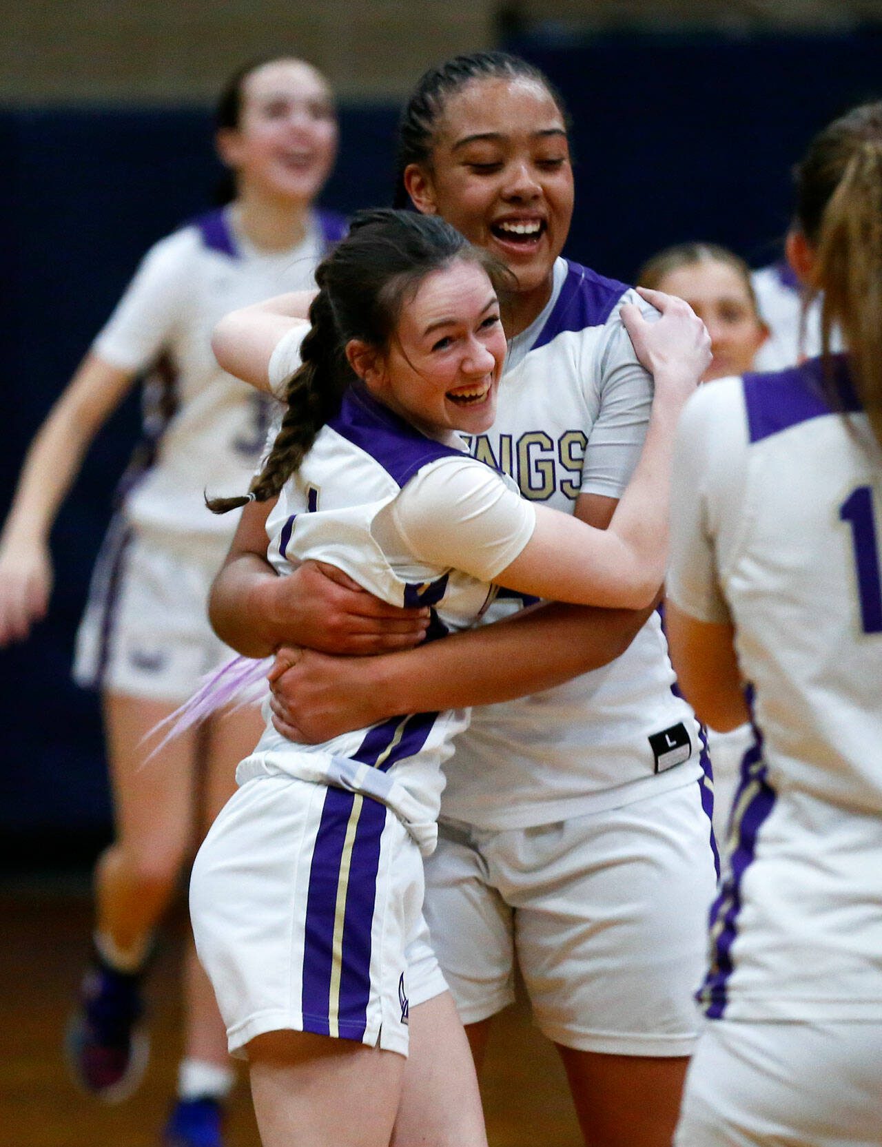 Lake Stevens players celebrate a victory over Skyview during a state regionals matchup Feb. 23 in Arlington. (Ryan Berry / The Herald)