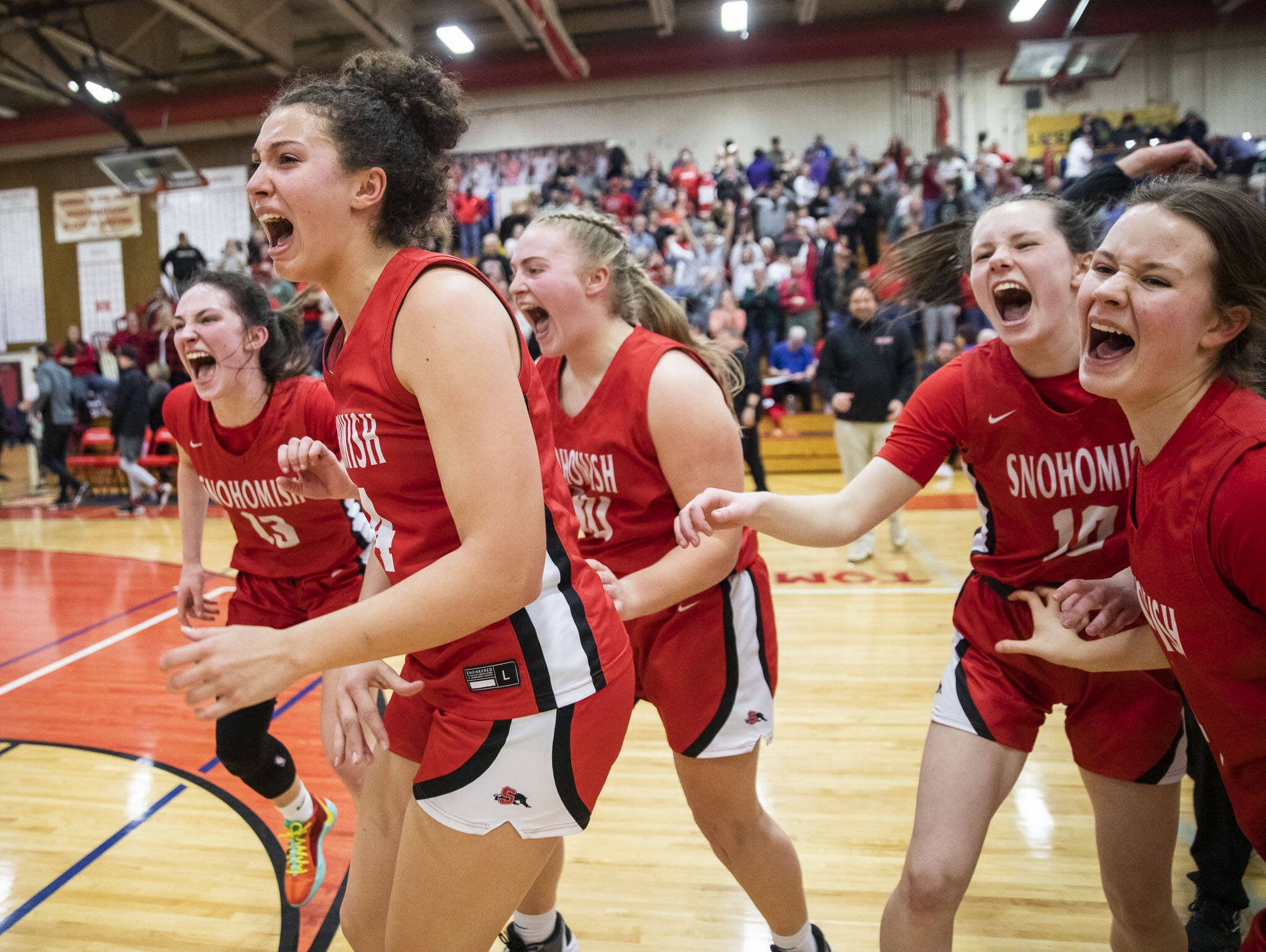 Snohomish players reacts to winning the 3A girls district championship on Feb. 17 in Marysville. (Olivia Vanni / The Herald)