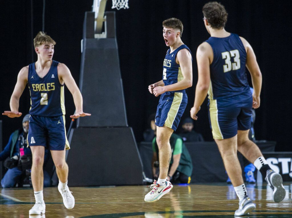 Arlington’s Jacoby Falor reacts to Arlington taking the lead during the 3A boys state basketball game against Garfield on Wednesday, Feb. 28, 2024 in Tacoma, Washington. (Olivia Vanni / The Herald)

