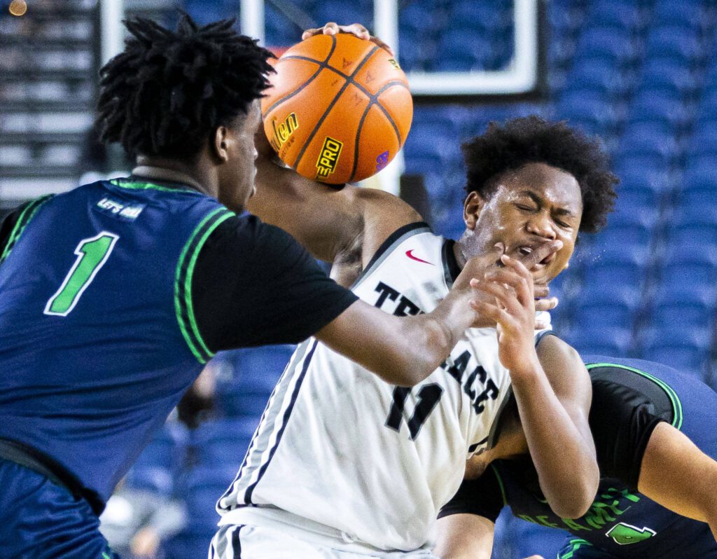 Mountlake Terrace’s Rayshaun Connor is hit in the face during the 3A boys state basketball game against Todd Beamer on Wednesday, Feb. 28, 2024 in Tacoma, Washington. (Olivia Vanni / The Herald)
