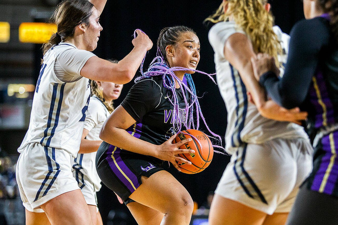 Lake Stevens’ Nisa Ellis looks for an open teammate to pass to during the 4A girls state basketball game against Gonzaga Prep on Wednesday, Feb. 28, 2024 in Tacoma, Washington. (Olivia Vanni / The Herald)