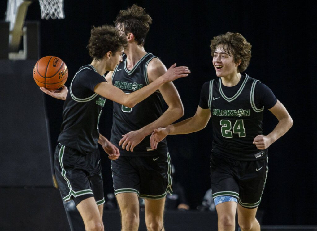 Jackson’s Colby Cooke high-fives Joey Gosling during the 4A boys state basketball game against Tahoma on Wednesday, Feb. 28, 2024 in Tacoma, Washington. (Olivia Vanni / The Herald)

