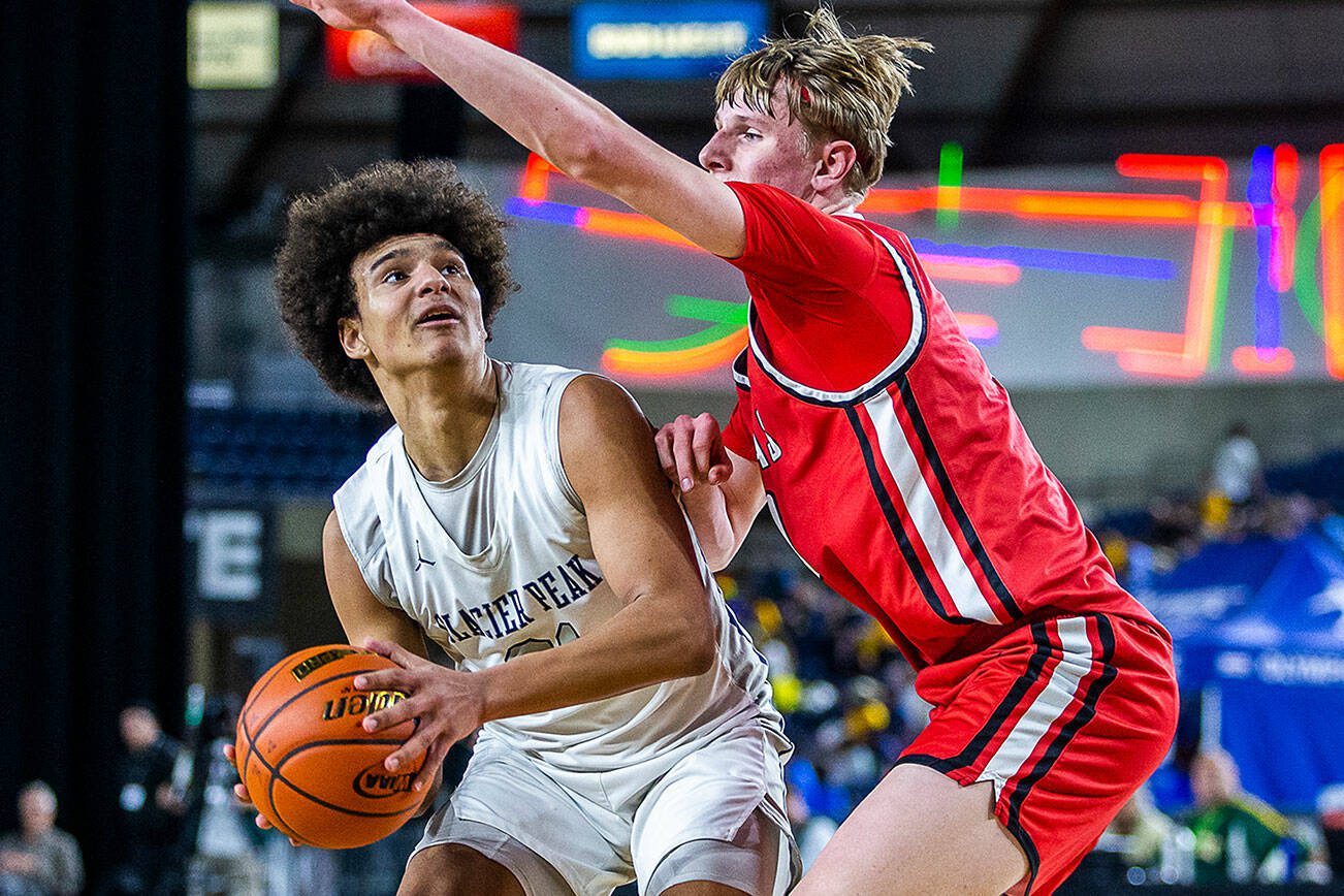 Glacier Peak’s Jayce Nelson looks for an open shot during the 4A boys state basketball game against Camas on Wednesday, Feb. 28, 2024 in Tacoma, Washington. (Olivia Vanni / The Herald)