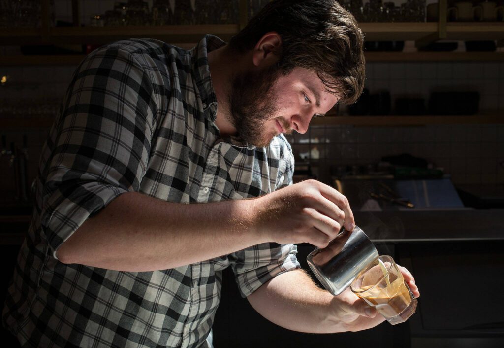 Narrative Coffee owner and head barista Maxwell Mooney at his business on Tuesday, June 27, 2017 in Everett, Wa. Mooney says one latte in Kirkland stirred his interest in coffee. (Andy Bronson / The Herald)
