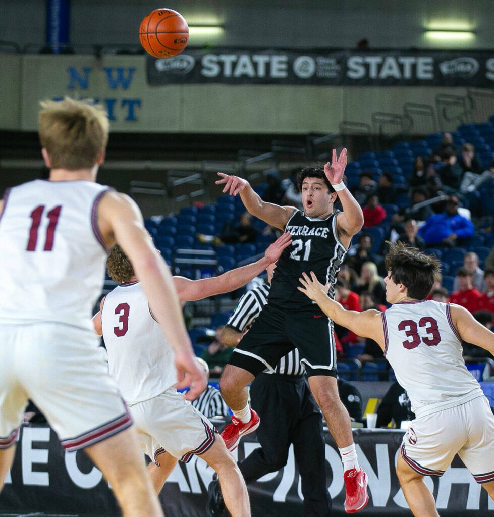 Mountlake Terrace senior Logan Tews passes out of a double team during a WIAA 3A Boys Basketball quarterfinal against Mount Spokane on Thursday, Feb. 29, 2024, at the Tacoma Dome in Tacoma, Washington. (Ryan Berry / The Herald)
