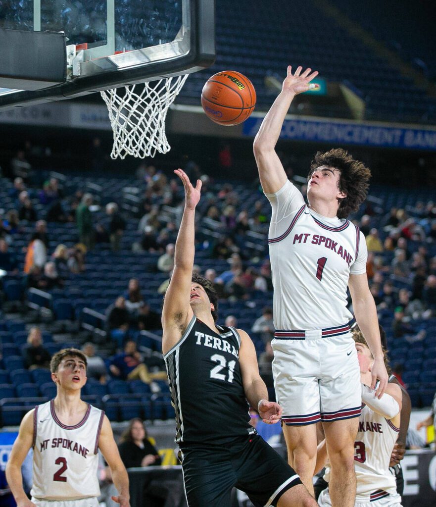 Mountlake Terrace’s Logan Tews is blocked by Andrew Rayment during a WIAA 3A Boys Basketball quarterfinal against Mount Spokane on Thursday, Feb. 29, 2024, at the Tacoma Dome in Tacoma, Washington. (Ryan Berry / The Herald)
