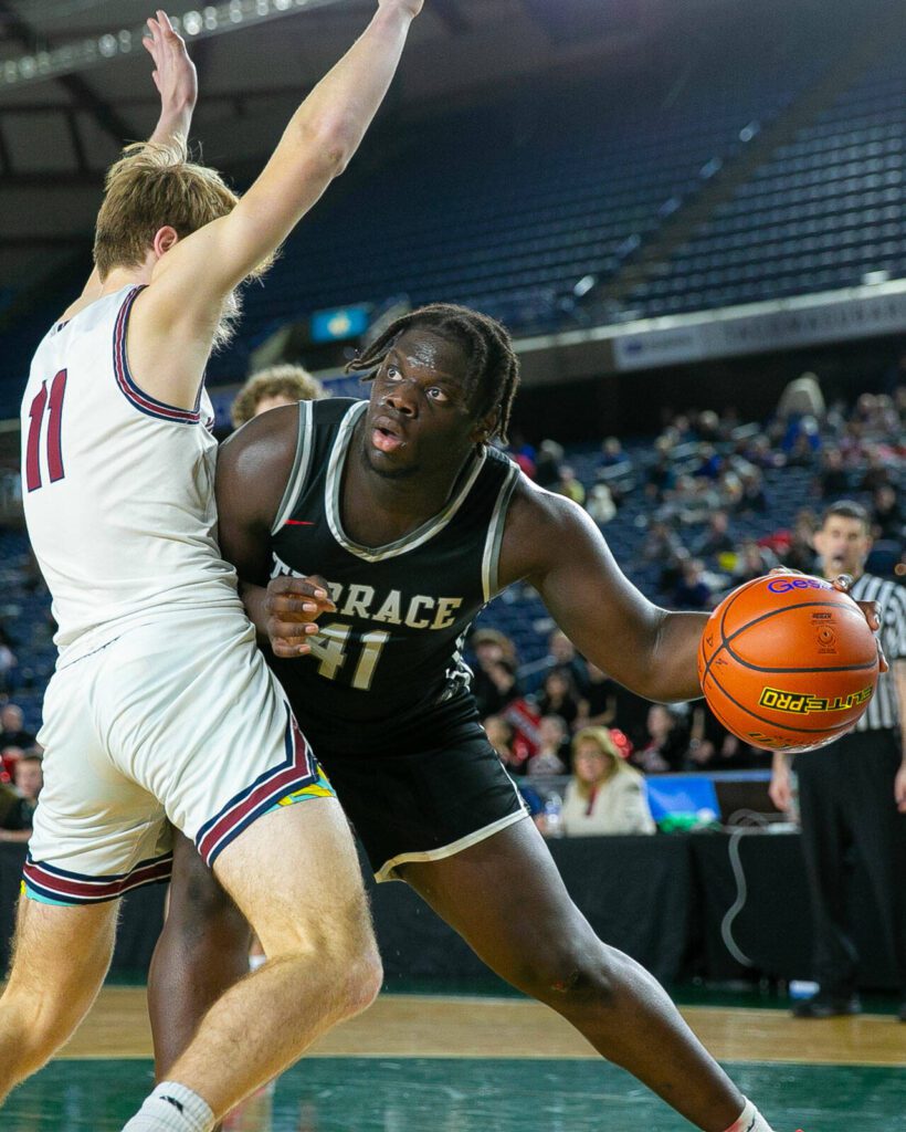 Mountlake Terrace senior Zaveon Jones tries to muscle his way to the rim during a WIAA 3A Boys Basketball quarterfinal against Mount Spokane on Thursday, Feb. 29, 2024, at the Tacoma Dome in Tacoma, Washington. (Ryan Berry / The Herald)
