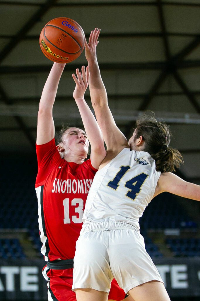 Snohomish sophomore guard Sienna Capelli gets fouled on a shot during a WIAA 3A Girls Basketball quarterfinal against Arlington on Thursday, Feb. 29, 2024, at the Tacoma Dome in Tacoma, Washington. (Ryan Berry / The Herald)
