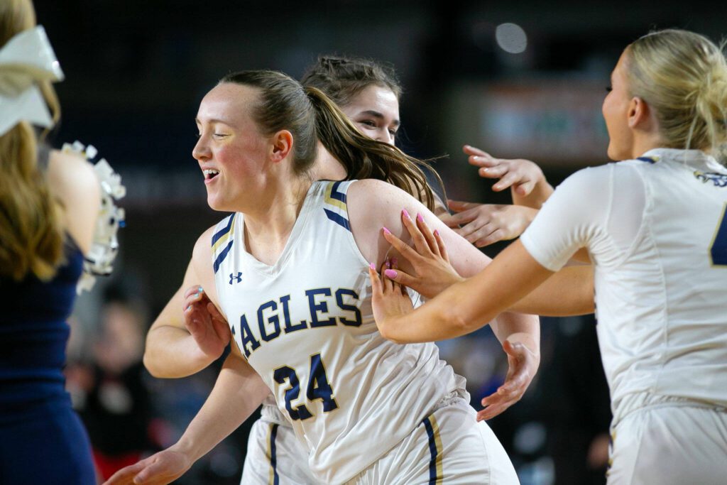 Arlington’s Katie Snow enters the floor during introductions prior to a WIAA 3A Girls Basketball quarterfinal against Snohomish on Thursday, Feb. 29, 2024, at the Tacoma Dome in Tacoma, Washington. (Ryan Berry / The Herald)
