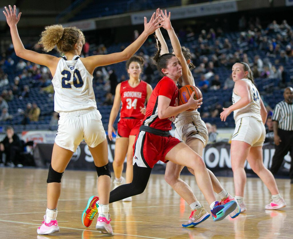 Snohomish’s Sienna Capelli drives through the defense on her way to the rim during a WIAA 3A Girls Basketball quarterfinal against Arlington on Thursday, Feb. 29, 2024, at the Tacoma Dome in Tacoma, Washington. (Ryan Berry / The Herald)
