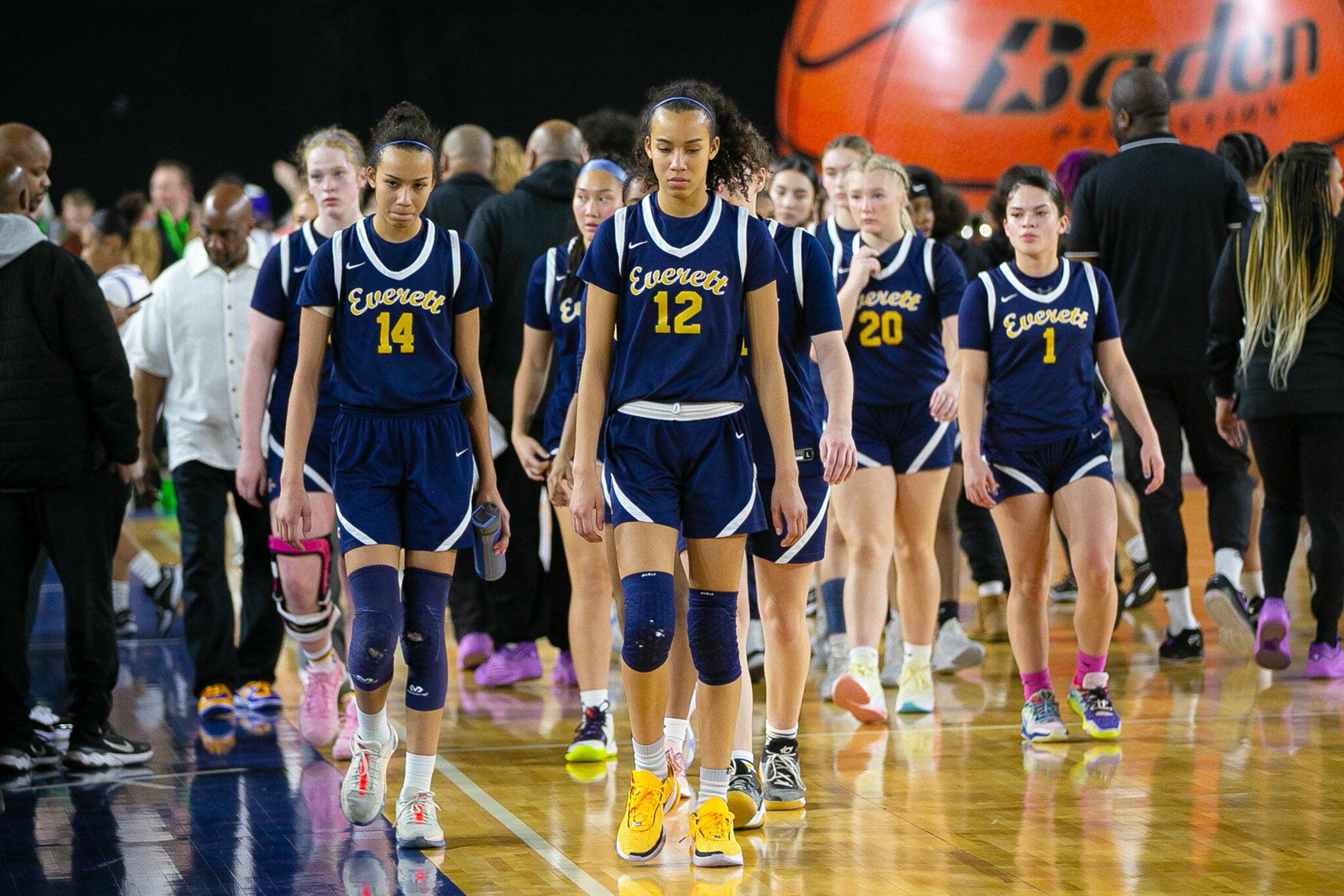 The Everett girls leave the court after falling short during a WIAA 3A Girls Basketball quarterfinal against Garfield on Thursday, Feb. 29, 2024, at the Tacoma Dome in Tacoma, Washington. (Ryan Berry / The Herald)