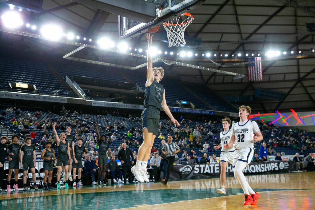 Glacier Peak’s Reed Nagel finishes a breakaway during a WIAA 4A Boys Basketball quarterfinal against Gonzaga Prep on Thursday, Feb. 29, 2024, at the Tacoma Dome in Tacoma, Washington. (Ryan Berry / The Herald)
