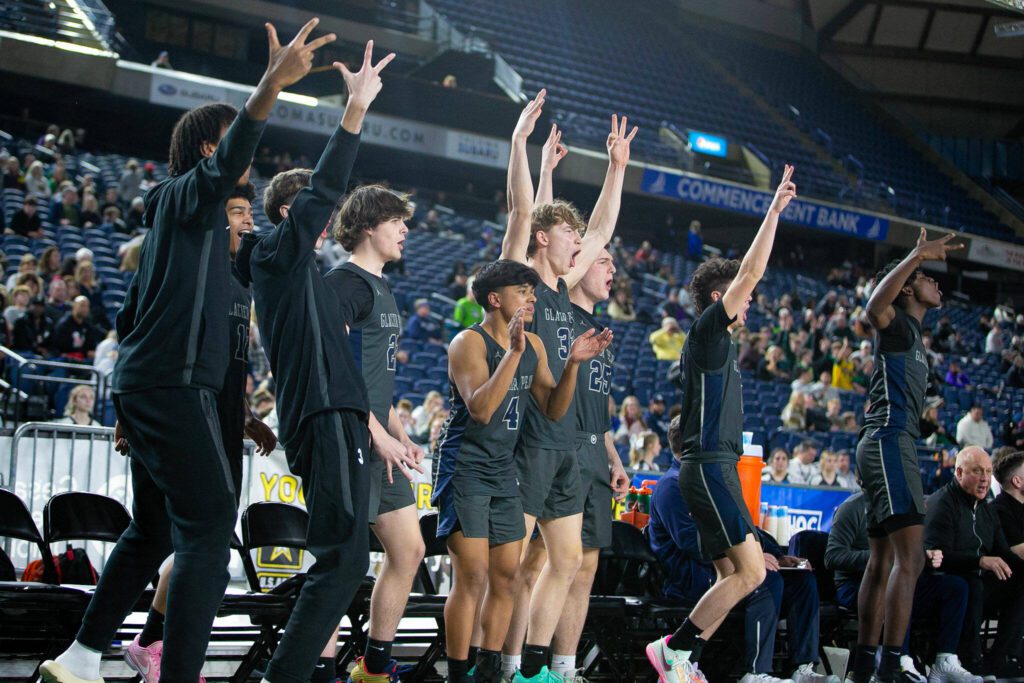 Glacier Peak’s bench goes wild for a Jo Lee three pointer during a WIAA 4A Boys Basketball quarterfinal against Gonzaga Prep on Thursday, Feb. 29, 2024, at the Tacoma Dome in Tacoma, Washington. (Ryan Berry / The Herald)
