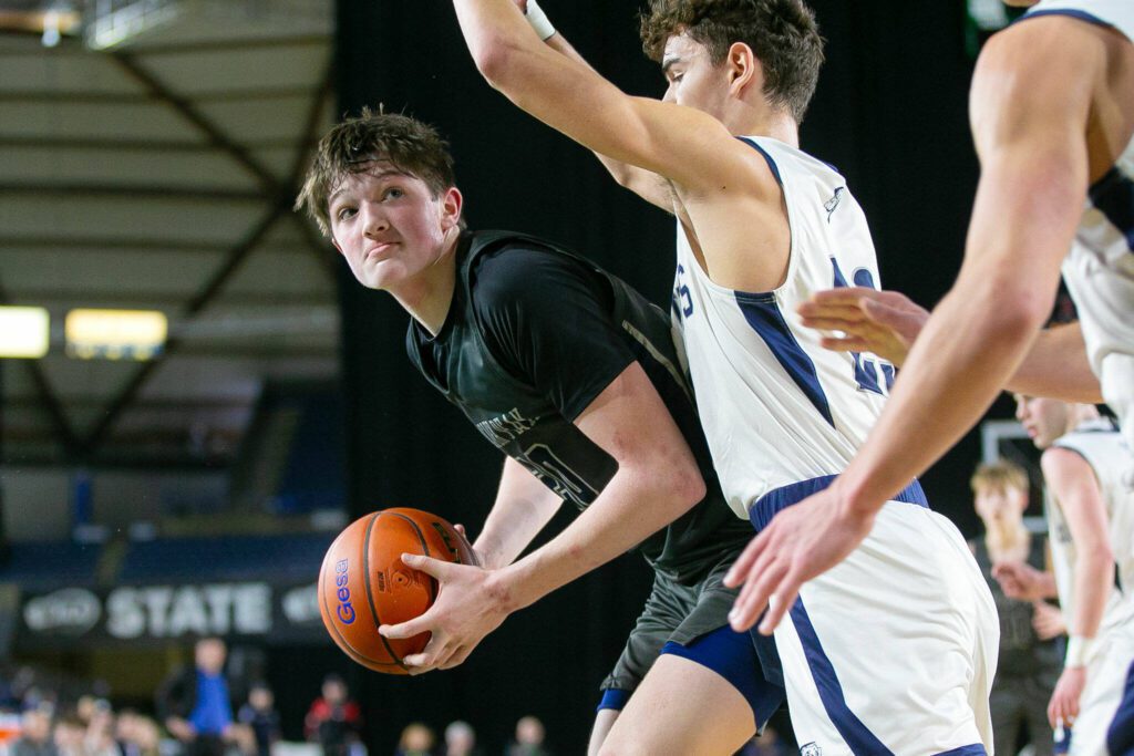 Glacier Peak freshman Zachary Albright tries to back down a defender during a WIAA 4A Boys Basketball quarterfinal against Gonzaga Prep on Thursday, Feb. 29, 2024, at the Tacoma Dome in Tacoma, Washington. (Ryan Berry / The Herald)
