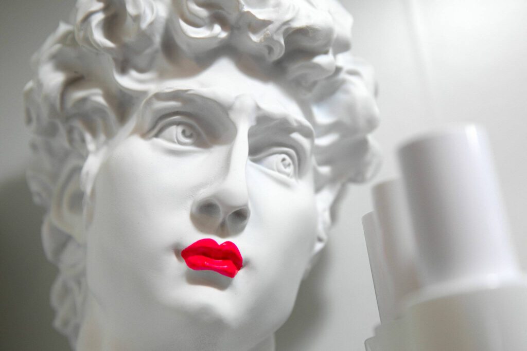Lipstick adorns a decorative statue at Bandbox Beauty. (Ryan Berry / The Herald)

