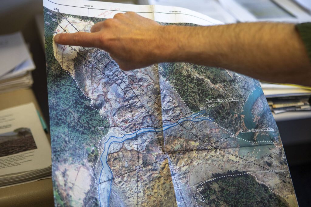 Geologist and University of Washington professor David Montgomery looks at a map of the Oso slide at his office in Johnson Hall on Thursday, Feb. 8, 2024, in Seattle, Washington. (Annie Barker / The Herald)
