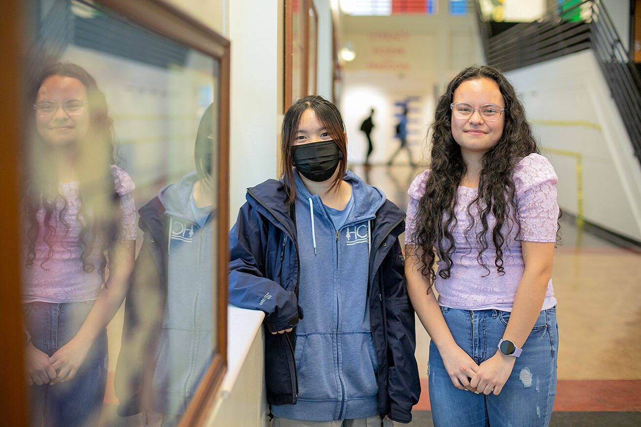 Sydney Vo and Azul Rangel, juniors at Mariner High School, stand in the entrance hallway at Mariner on Wednesday, Feb. 28, 2024, in Everett, Washington. The two have won the Congressional App Challenge in Washington’s Second District for the second year in a row, this time for the creation of HopeHorizon. (Ryan Berry / The Herald)