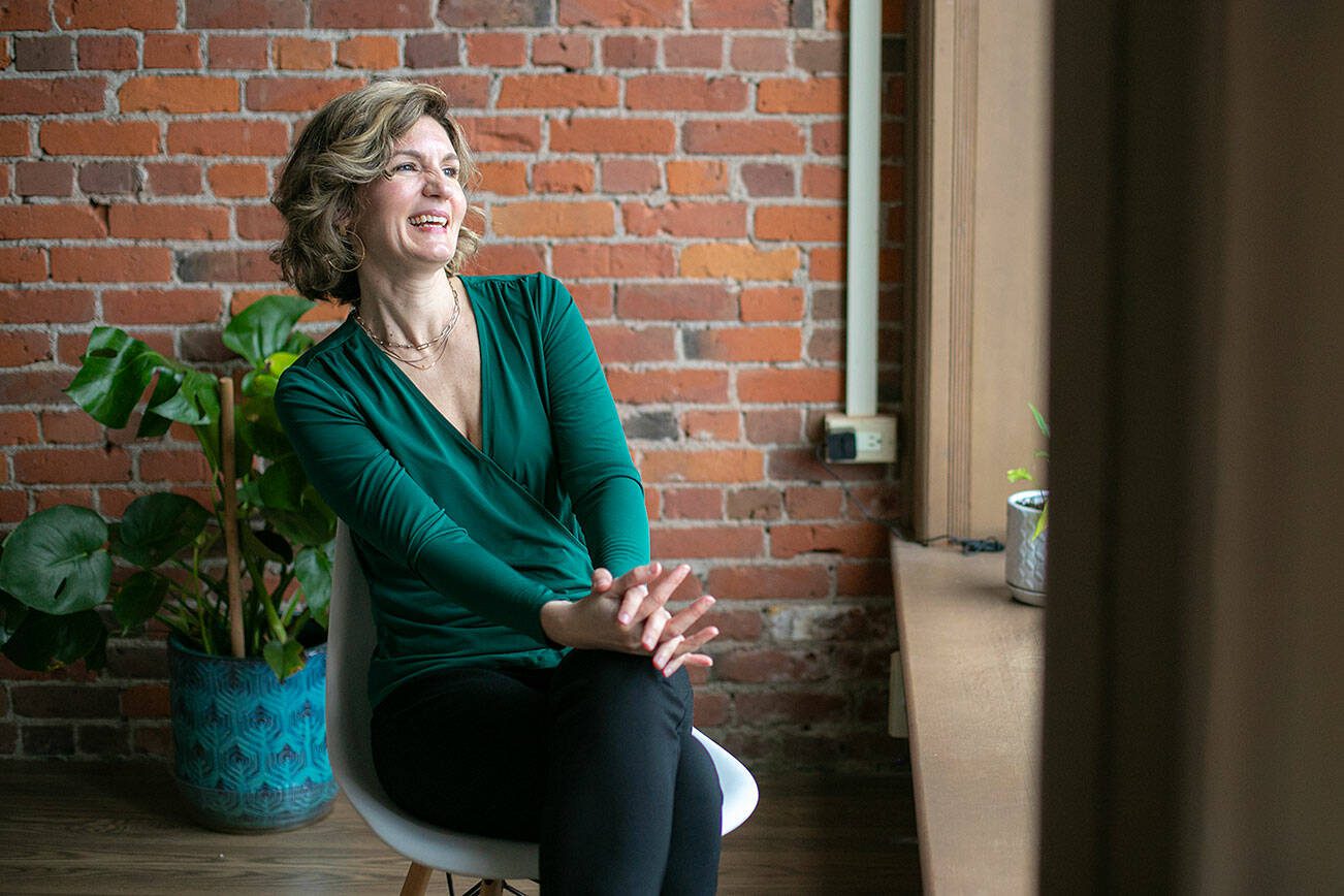 Maygen Hetherington, executive director of the Historic Downtown Snohomish Association, laughs during an interview in her office on Thursday, Feb. 15, 2024, in Snohomish, Washington. (Ryan Berry / The Herald)