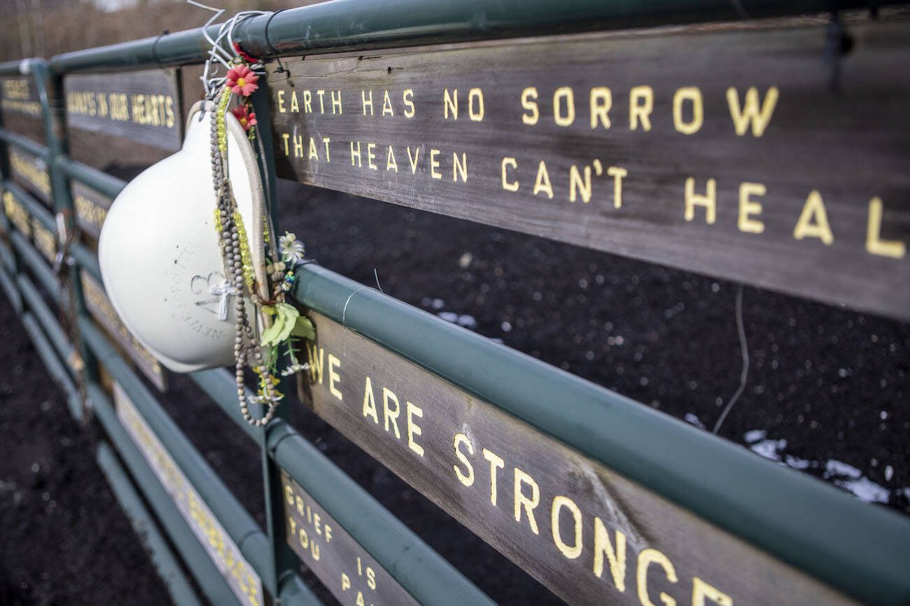 Carvings with words of tribute are displayed at the Oso Landslide Memorial on Monday, Feb. 26, 2024, in Arlington, WA. (Annie Barker / The Herald)