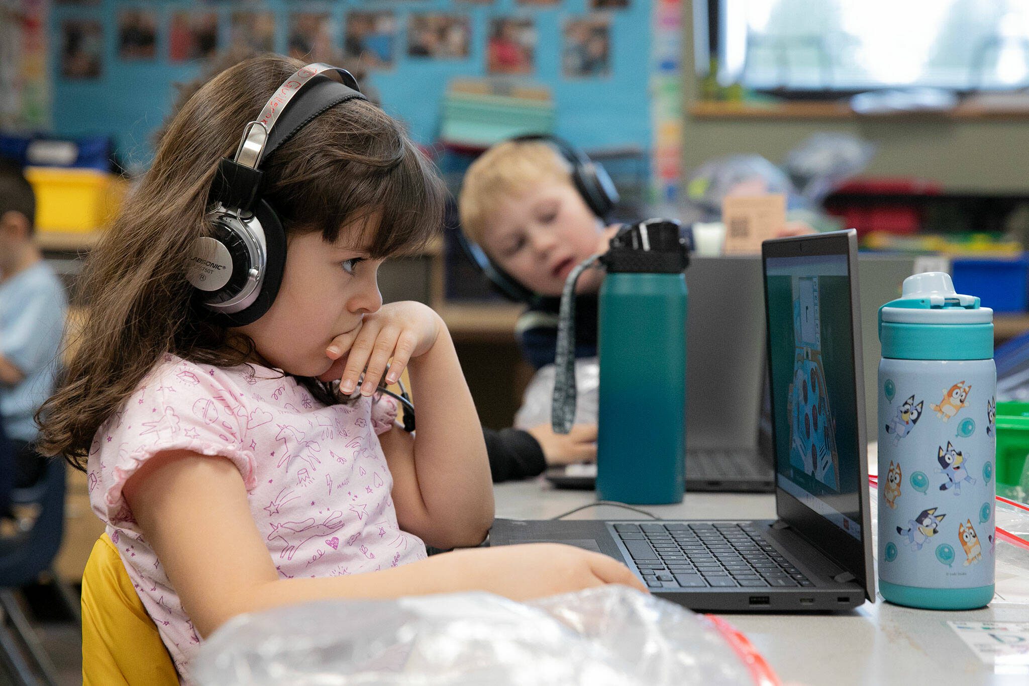 A kindergarten student works on a computer at Emerson Elementary School on Wednesday, Feb. 28, 2024, in Everett, Washington. (Ryan Berry / The Herald)