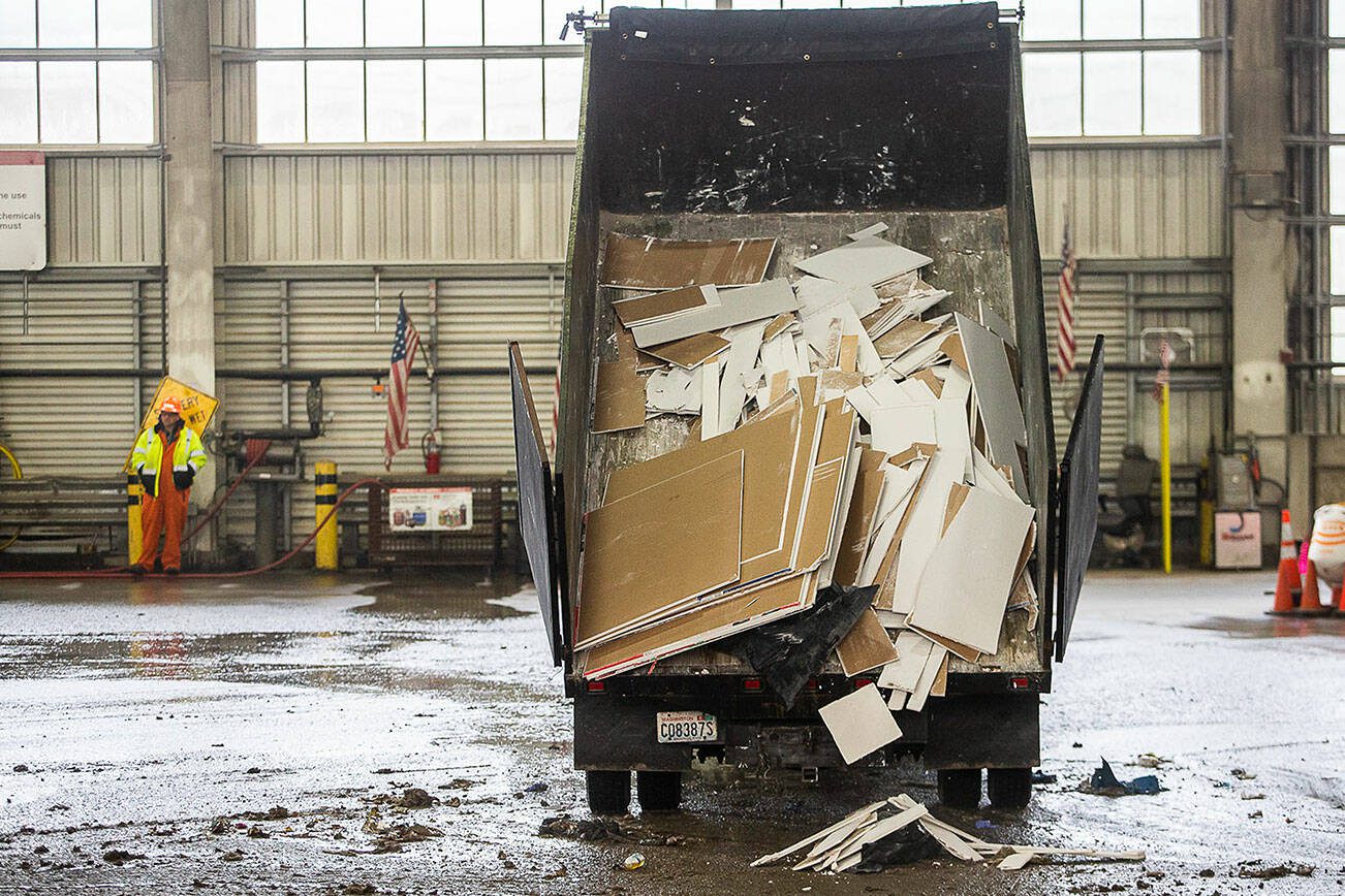 A truck dumps sheet rock onto the floor at Airport Road Recycling & Transfer Station on Thursday, Nov. 30, 2023 in Everett, Washington. (Olivia Vanni / The Herald)