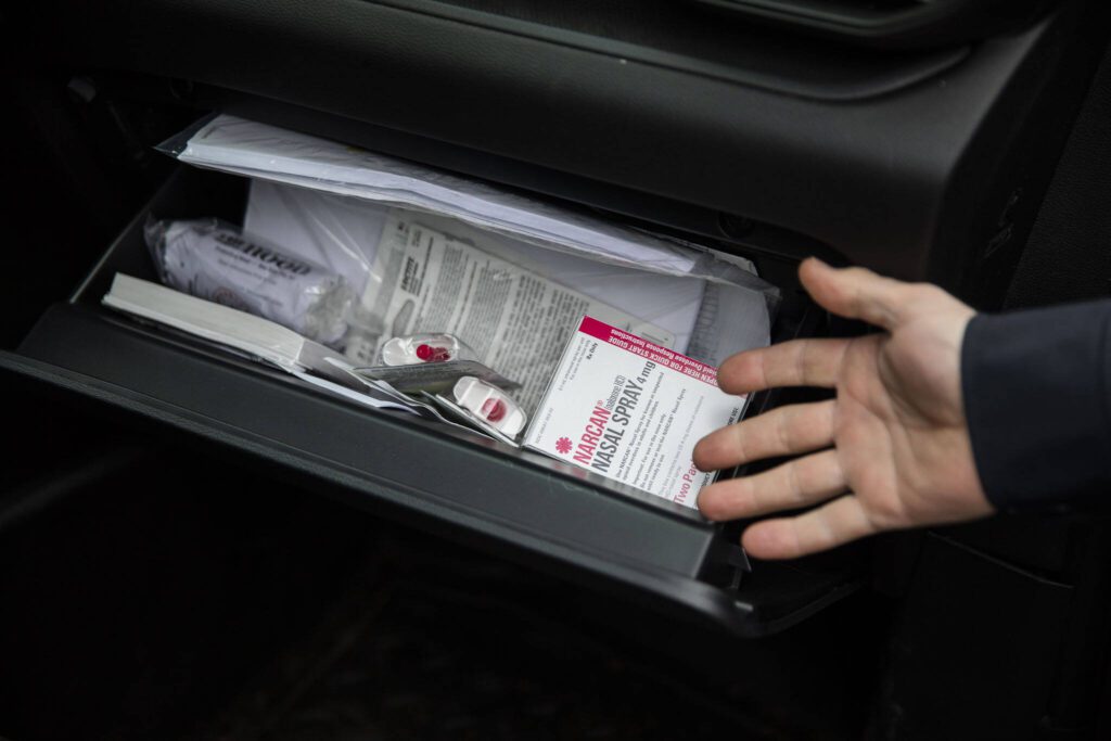 Naloxone to be given away inside the glove compartment of a Mountlake Terrace police vehicle on Thursday, Feb. 29, 2024 in Mountlake Terrace, Washington. (Olivia Vanni / The Herald)
