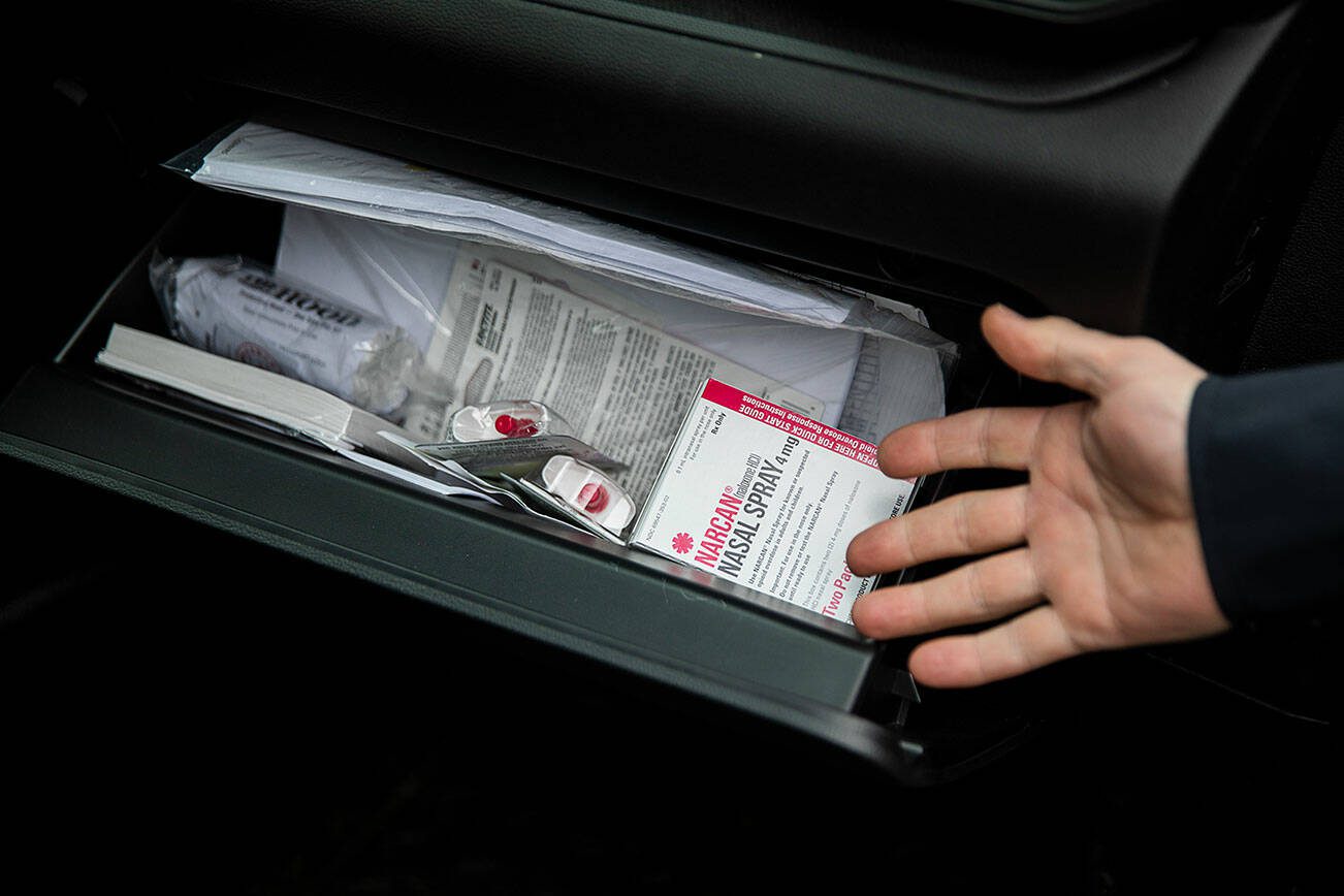 Naloxone to being given away inside the glove compartment of a Mountlake Terrace police vehicle on Thursday, Feb. 29, 2024 in Mountlake Terrace, Washington. (Olivia Vanni / The Herald)