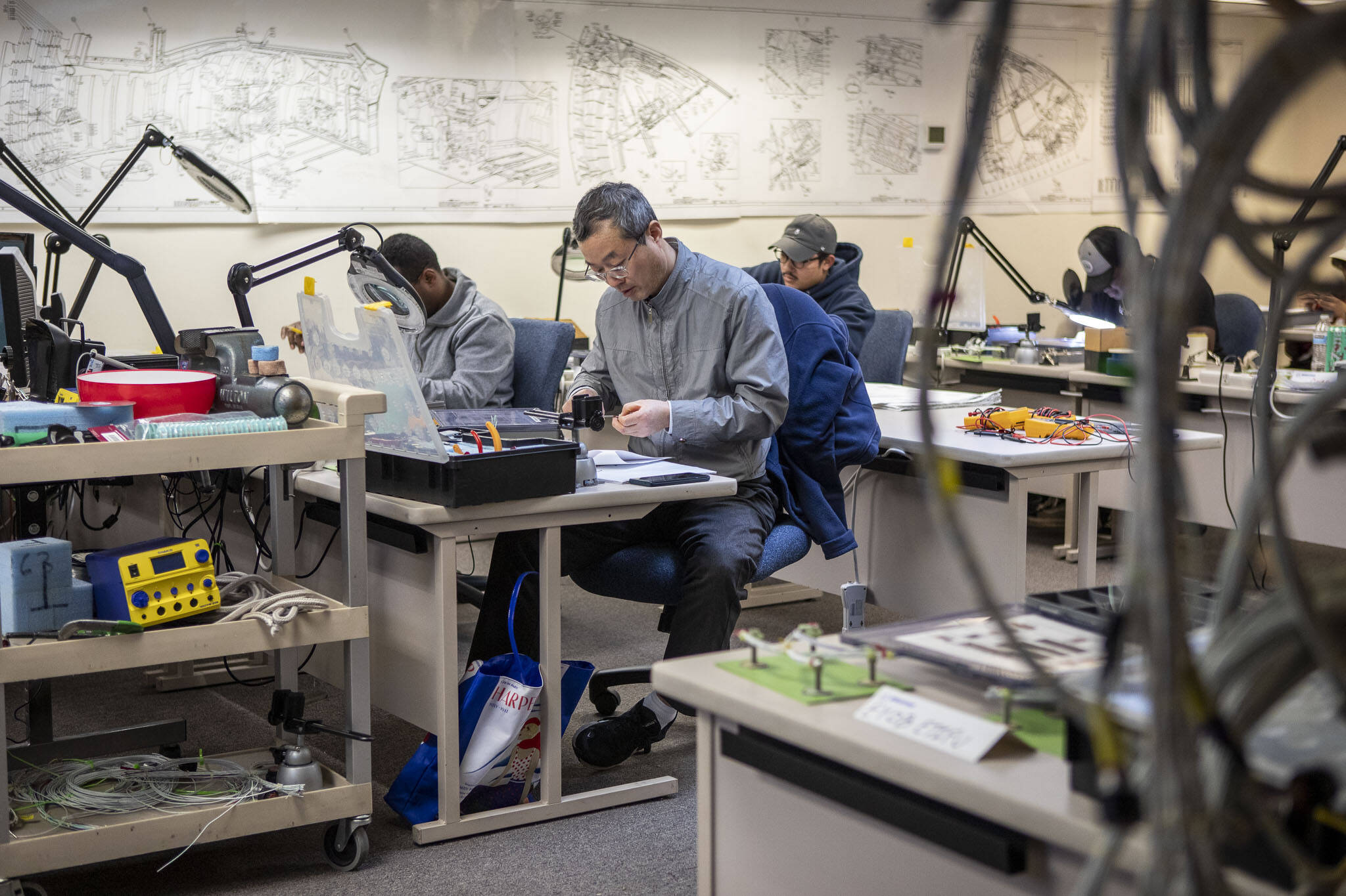 Students work during a class at the Washington Aerospace Training and Research Center on Wednesday, March 6, 2024 in Everett, Washington. (Annie Barker / The Herald)