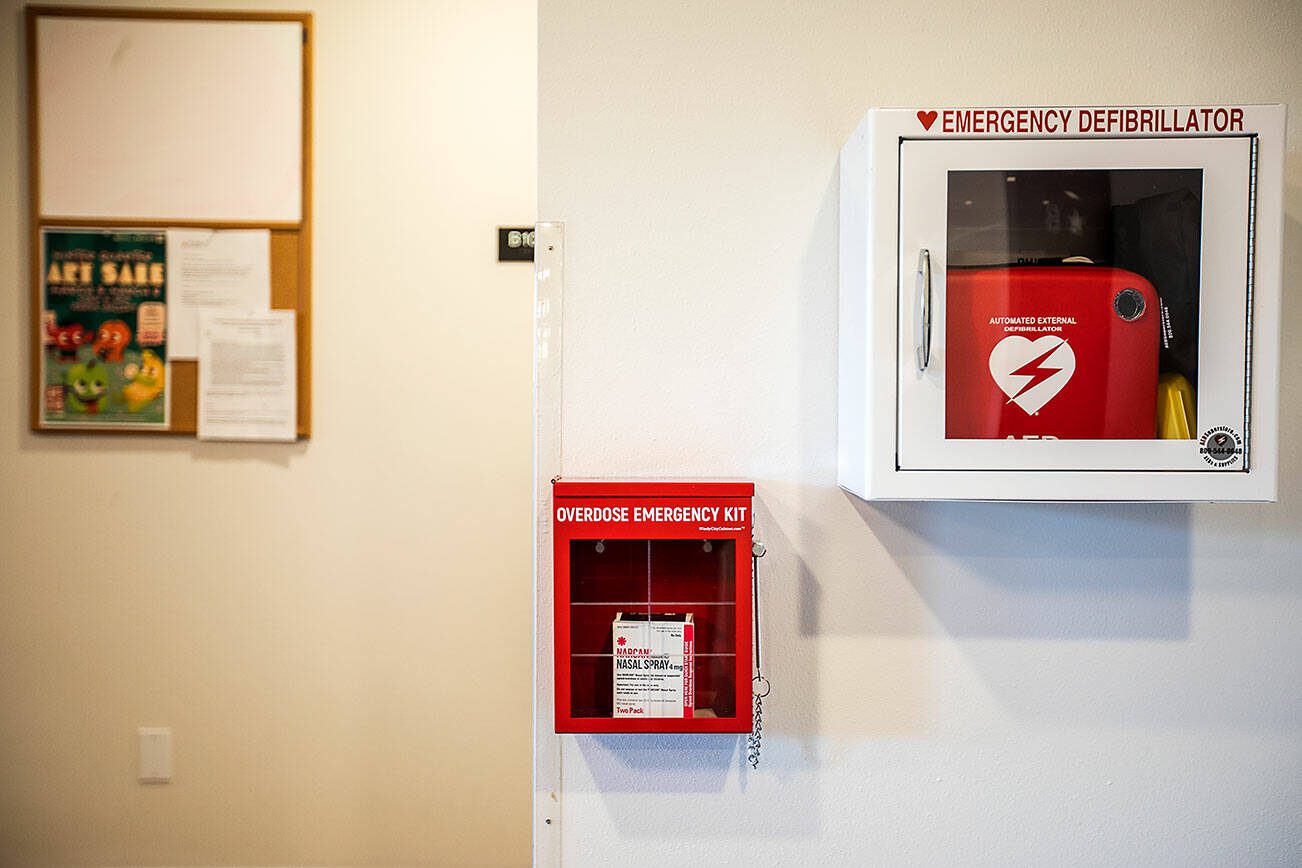 An emergency overdose kit with naloxone located next to an emergency defibrillator at Mountain View student housing at Everett Community College on Tuesday, March 5, 2024 in Everett, Washington. (Olivia Vanni / The Herald)