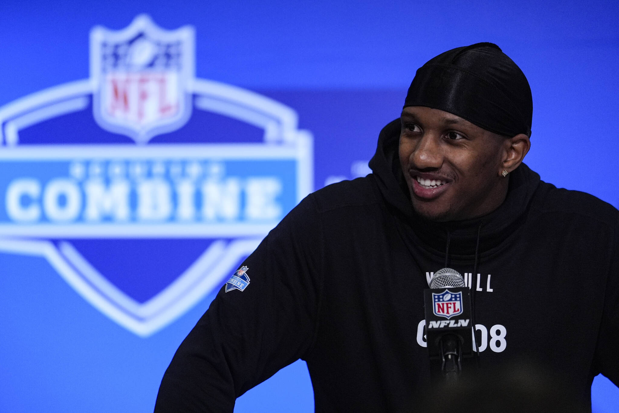 Washington quarterback Michael Penix speaks during a press conference at the NFL football scouting combine Friday in Indianapolis. (AP Photo/Michael Conroy)