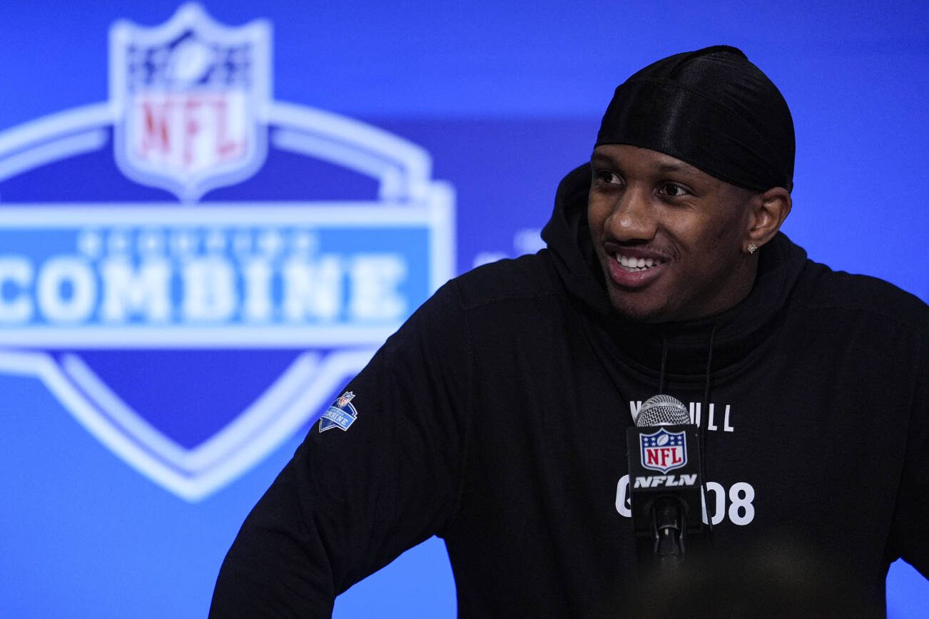 Washington quarterback Michael Penix speaks during a press conference at the NFL football scouting combine in Indianapolis, Friday, March 1, 2024. (AP Photo/Michael Conroy)