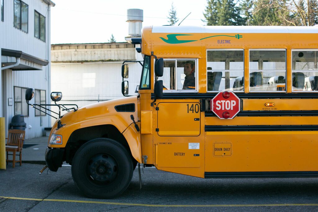 Snohomish School District Transportation Supervisor Karl Hereth backs up the district’s electric school bus Thursday, March 7, 2024, at the district bus depot in Snohomish, Washington. (Ryan Berry / The Herald)
