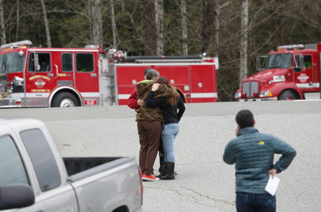 Residents gather at the Oso Fire Department to look for updates about the mudslide in Oso, Washington, on March 22, 2014. (Annie Mulligan / For The Herald)
