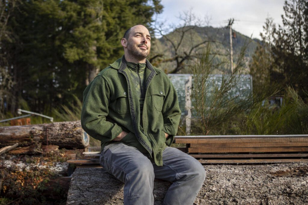 Glacier Peak Institute Executive Director Oak Rankin poses for a photo at 1405 Emens Ave N in Darrington, Washington on Friday, Feb. 17, 2023. Environmental and outdoor education lessons are woven throughout the in-school and after-school activities in this small community, thanks to the Glacier Peak Institute. The non-profit arose from community concerns in the wake of the Oso landslide disaster. (Annie Barker / The Herald)
